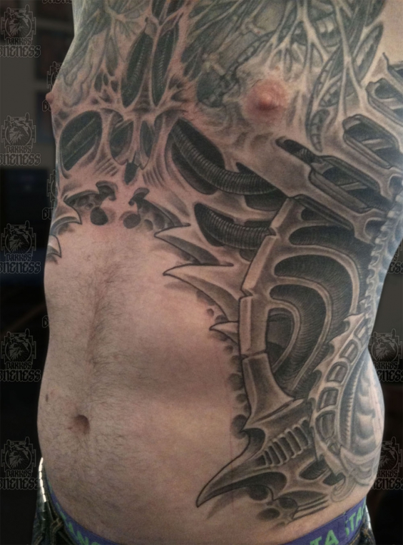 Tattoo Skulls biomechanical ribs by Darko groenhagen